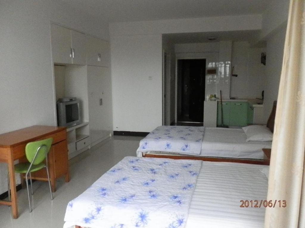Xingfu Hotel Nanning Rom bilde
